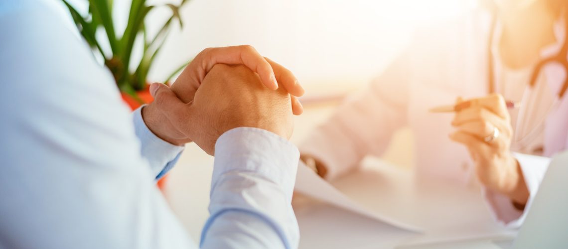Man having medical consultation in doctor's office