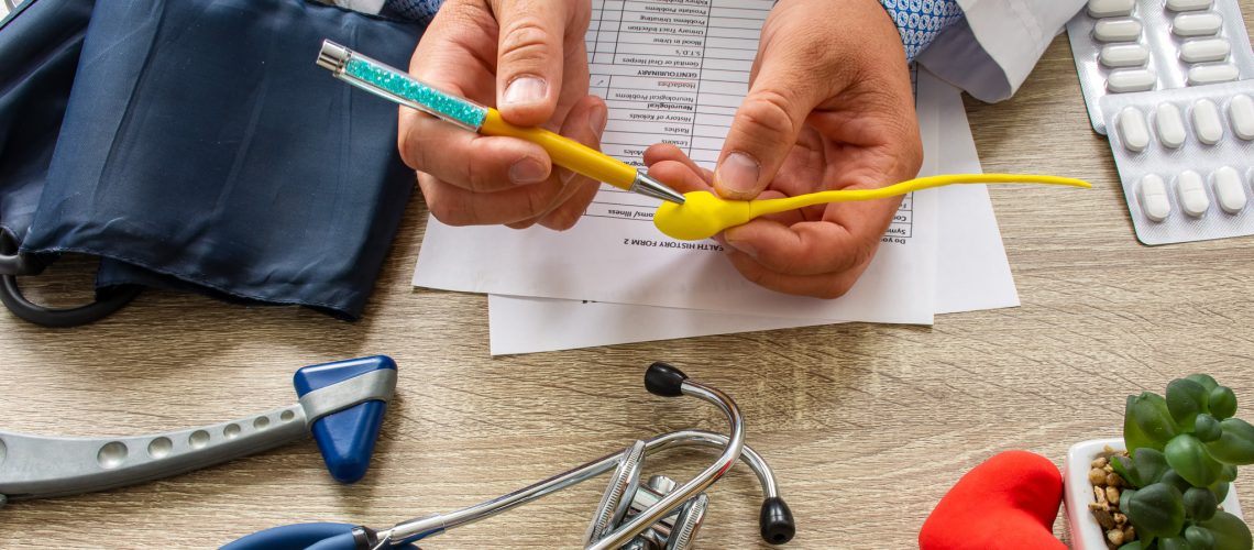 Doctor during consultation held in his hand and shows patient an